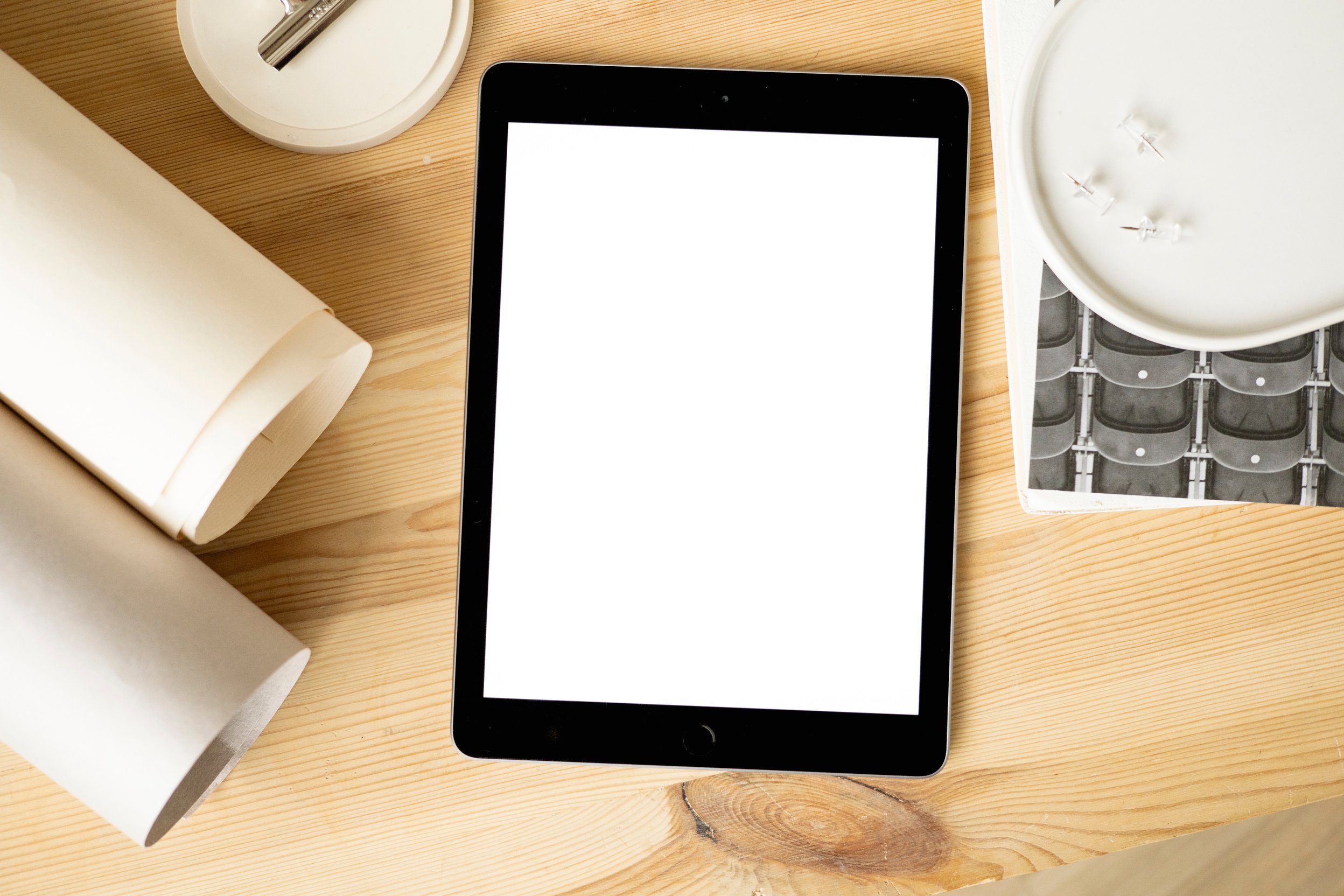 Black Ipad on Brown Wooden Surface 